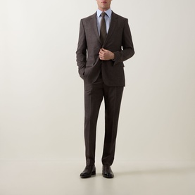 Model wearing Boss Black Casual Single-Breasted Suit Jacket in dark brown with matching trousers, light blue shirt, grey tie and black dress shoes.