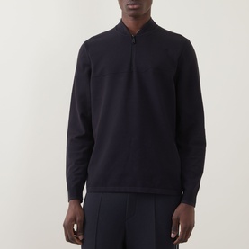 Model wearing Boss Green Label Terrace Logo Half-Zip Sweatshirt in dark blue with bomber collar, styled with matching dark blue trousers.