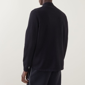 Model wearing Boss Green Label Terrace Logo Half-Zip Sweatshirt in dark blue, back view, with matching dark blue joggers.