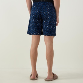 Model wearing Hugo Milo Logo Pyjama Shorts in dark blue cotton with all-over logo print, elasticated drawstring waist. Back view