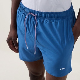 Hugo Boss blue swim shorts with pink drawstring, elasticated waistband and embroidered logo, modelled from waist to mid-thigh.
