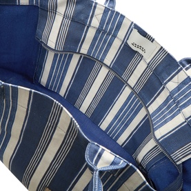 Isabel Marant Yenky Zipped Tote Bag in blue and white stripe cotton, showing interior lining detail with silver-tone hardware and zip fastening