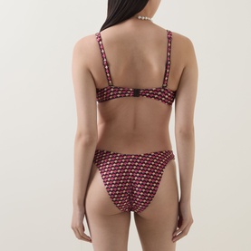 Model wearing Jets Rose geometric-print bikini brief with matching bralette top, back view