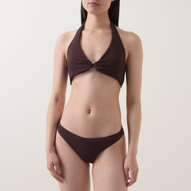 Model wearing Jets Bikini Brief in chocolate, paired with matching halterneck bikini top with ring detail