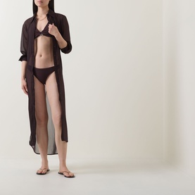Model wearing Jets Chocolate Bikini Top with matching briefs, styled with a sheer longline cover-up and brown flip-flops