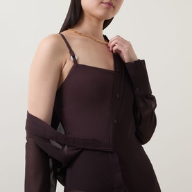 Model wearing Jets Alessia Textured Swimsuit in Chocolate with square neckline and adjustable straps, styled with a sheer chocolate cardigan and gold
