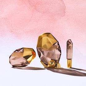OREBELLA Window2Soul Parfum 50ml in amber faceted crystal-cut bottles with gold bases, displayed with a miniature rollerball