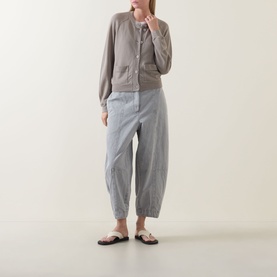 Model wearing Transit Patch Pocket Cardigan in Rope, styled with grey tapered trousers and flat sandals.
