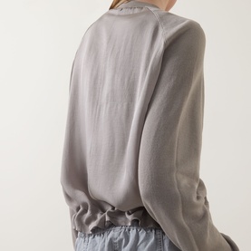 Model wearing Transit Patch Pocket Cardigan in Rope, back view, styled with light blue trousers