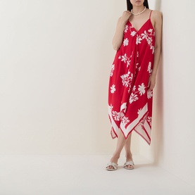 Model wearing Seafolly Mayflower Scarf Dress in Cosmo Red, floral print, handkerchief hem, spaghetti straps, styled with pearl necklace and silver