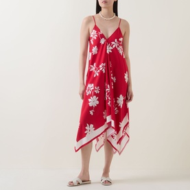 Model wearing Seafolly Mayflower Scarf Dress in Cosmo Red, floral print, handkerchief hem, spaghetti straps, styled with pearl necklace and sandals