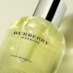 Burberry Weekend For Women Eau de Parfum bottle in pale green glass with silver cap, close-up shot