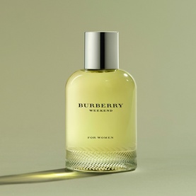 Burberry Weekend For Women Eau de Parfum in yellow-green glass bottle with silver cap on sage green background