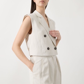 Model wearing Marc O Polo Double-Breasted Cropped Waistcoat in beige linen blend, notch lapel, dark buttons, styled with matching wide-leg trousers