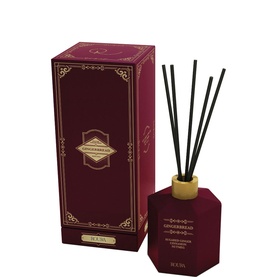 Roura Winter-Seduction Gingerbread Reed Diffuser 100ml in deep red hexagonal bottle with bamboo cap and black reeds, with matching gift box