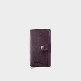 Secrid Basco Ink Leather Miniwallet in burgundy with gunmetal-tone snap closure and silver-tone metal card lever