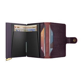 Secrid Basco Ink Leather Miniwallet in burgundy, open showing aluminium card slide mechanism and multiple card slots with gold-tone button closure