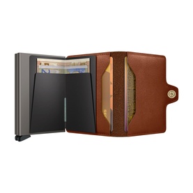 Secrid Texano Twinwallet in brown leather, open showing dual aluminium card protectors with cards and notes visible, compact fold design