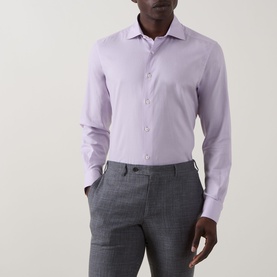 Model wearing lilac slim fit dress shirt with cutaway collar and single cuffs, styled with grey tailored trousers