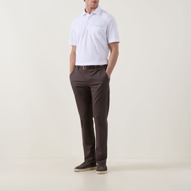 Model wearing Zegna white linen cashmere silk polo shirt with chest pocket, styled with dark brown chinos and navy loafers