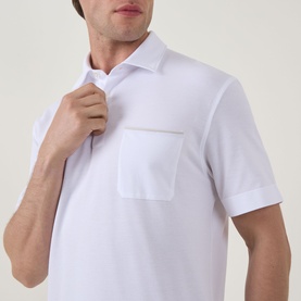 Model wearing Zegna white linen cashmere silk polo shirt with chest pocket and open collar, short sleeves