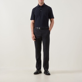 Model wearing Zegna navy linen cashmere silk polo shirt, styled with dark tailored trousers, black leather belt and loafers.