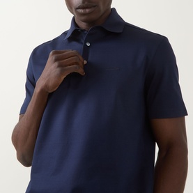 Model wearing Zegna Piquet Polo Shirt in Dark Indigo, featuring polo collar, three-button placket and short sleeves