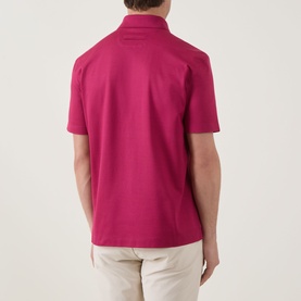 Model wearing Zegna dark pink cotton polo shirt, rear view, paired with stone chinos