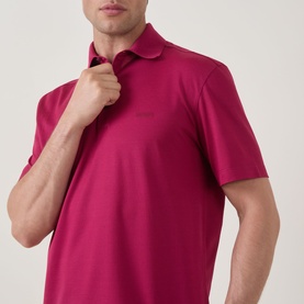 Model wearing Zegna dark pink cotton polo shirt, short sleeves and classic collar, adjusting neckline