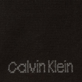 Calvin Klein Socks black multi pack, close-up of woven logo detail in dark fabric, 70% cotton blend