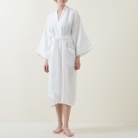 Model wearing Olivia von Halle Tie-Fastening Silk Robe in Ivory Core, shawl collar, wide sleeves, wrap front with self-fabric belt tie