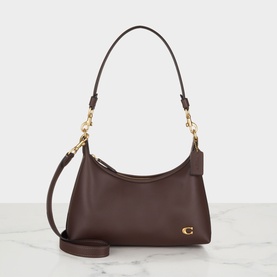 Coach shoulder bag in Maple leather with gold-tone hardware and detachable crossbody strap