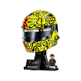 Lego McLaren F1 helmet building set in multi-colour yellow and orange, with mini figurine on display stand