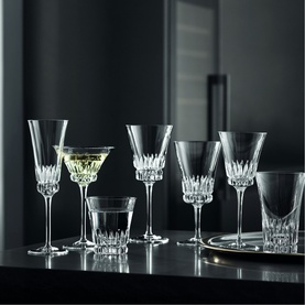 Villeroy & Boch Grand Royal Clear crystal glassware collection displayed on dark surface, including wine goblets, martini and rocks glasses