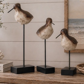 Mindy Browne Bird Ornamental Figurines, set of three brown and cream polystone birds on black metal stands, styled on wooden surface.