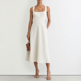 Model wearing Reiss white sleeveless midi dress with square neckline and A-line skirt, styled with nude heels and tan mini bag.
