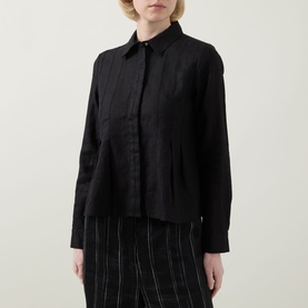Model wearing InWear Dilana Pleated Linen Shirt in black, featuring point collar, concealed placket and front pleats, styled with striped wide-leg