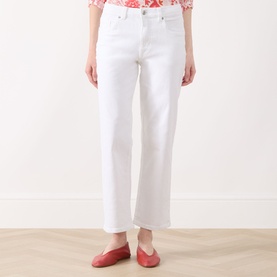 Model wearing Part Two Judyas Cropped Straight Leg Jeans in white, styled with a red floral top and red flat shoes.