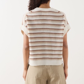 Model wearing Part Two Belisia Striped Sweater in beige with brown stripes, short sleeves, ribbed knit, back view, styled with khaki trousers.
