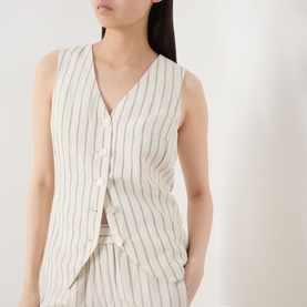 Model wearing Part Two cream pinstripe linen-viscose waistcoat top with V-neck and button fastening, styled with matching shorts