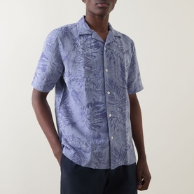 Model wearing Boggi Milano Jacquard Print Shirt in navy blue, camp collar, short sleeves, tonal tropical jacquard pattern, styled with dark trousers.