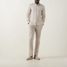 Model wearing Boggi Milano Sand Linen Casual Shirt with pointed collar and long sleeves, styled with matching sand chinos and suede desert boots.