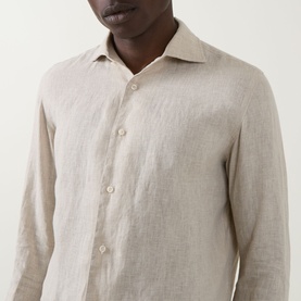 Model wearing Boggi Milano Linen Casual Shirt in sand, featuring pointed collar, long sleeves and button fastenings in lightweight linen fabric.