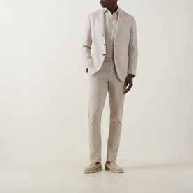 Model wearing Boggi Milano Sand Linen Casual Shirt, styled with a matching sand linen blazer and trousers, and beige loafers.