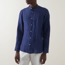 Model wearing Boggi Milano navy blue linen casual shirt with mandarin collar and button front, styled with white trousers.