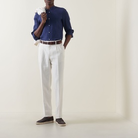 Model wearing Boggi Milano navy blue linen casual shirt, styled with white trousers and brown belt.