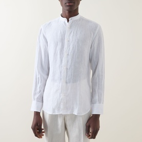 Model wearing Boggi Milano white linen casual shirt with mandarin collar and button placket, styled with cream trousers.