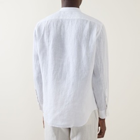 Model wearing Boggi Milano white linen casual shirt, rear view, with relaxed fit and button cuffs, styled with light trousers