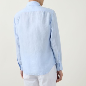 Model wearing Boggi Milano light blue linen casual shirt, rear view, paired with white trousers