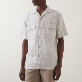 Model wearing Boggi Milano sand linen casual shirt, short sleeves, camp collar, twin chest pockets, paired with beige trousers